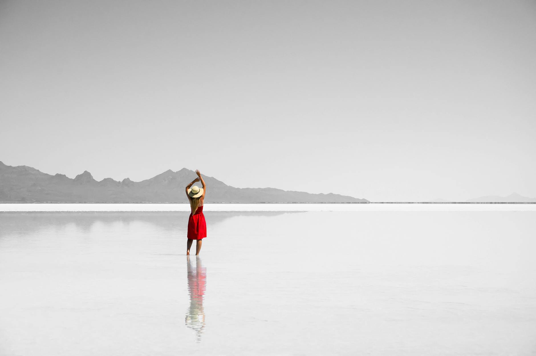 woman standing in the middle of the sea
