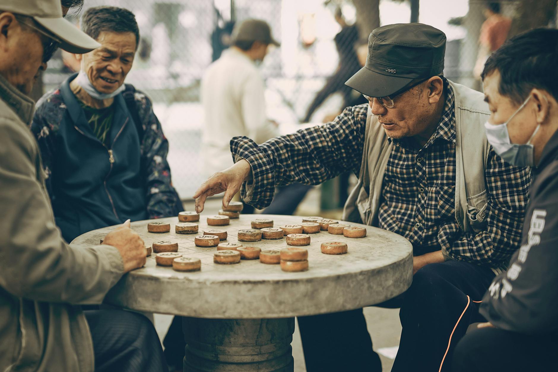 group of elderly men playing board game