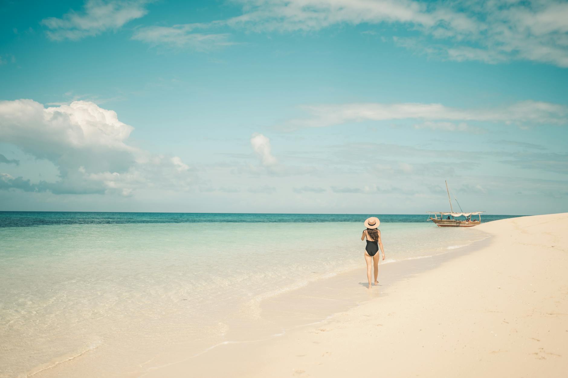 woman walking on shore