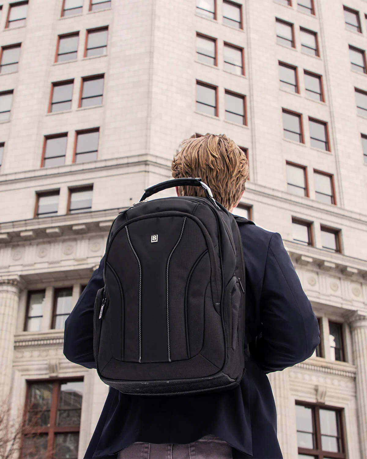 Someone wearing a Level8 backpack - Best Laptop Backpack for MacPro Users