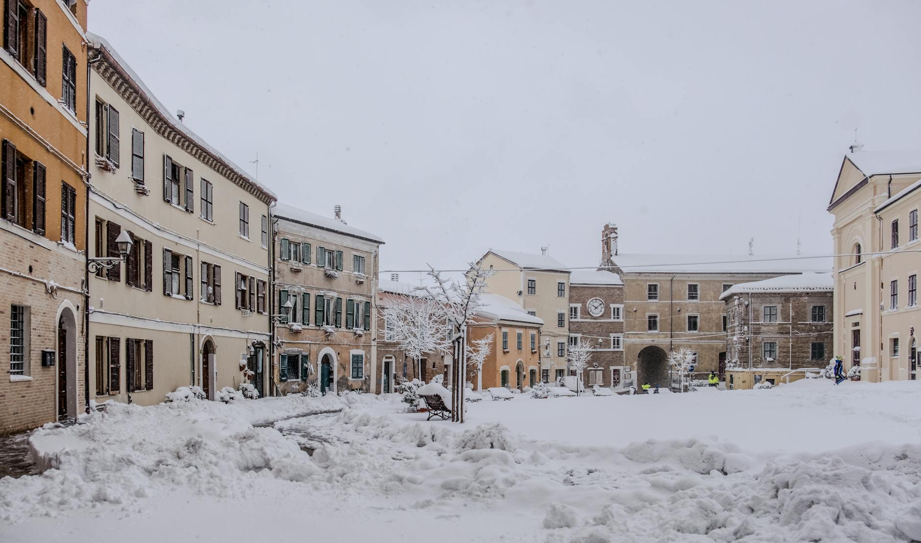 snow covered european town square in winter